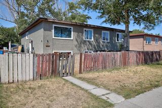 Photo 1: 2211, 2209 48 Street SE in Calgary: Forest Lawn 4 plex for sale : MLS®# A2007975