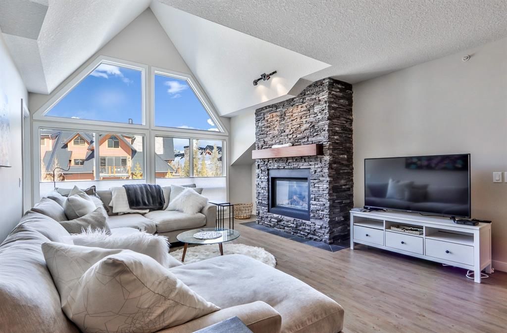Main Photo: 301 106 Stewart Creek Landing: Canmore Apartment for sale : MLS®# A1255289