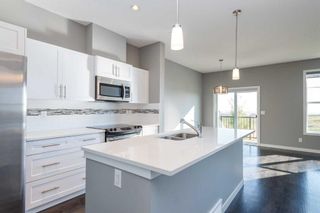 Photo 5: 1403 881 Sage Valley Boulevard NW in Calgary: Sage Hill Row/Townhouse for sale : MLS®# A2082484