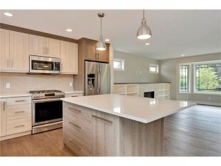 Photo 2: 5628 LODGE Crescent SW in Calgary: Lakeview House for sale : MLS®# C4070560
