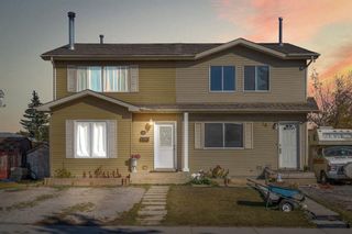 Main Photo: 20 Falshire Way NE in Calgary: Falconridge Semi Detached (Half Duplex) for sale : MLS®# A2120876