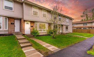 Main Photo: 80 123 Queensland Drive SE in Calgary: Queensland Row/Townhouse for sale : MLS®# A2135440