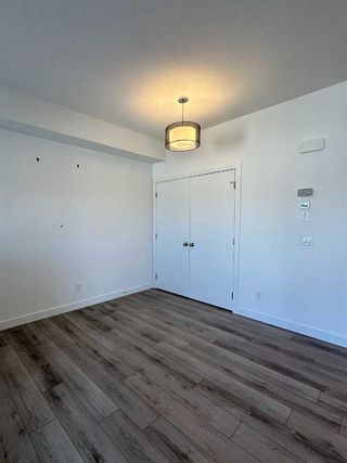 Photo 7: 128 Spring Creek Common SW in Calgary: Springbank Hill Row/Townhouse for sale : MLS®# A2109387