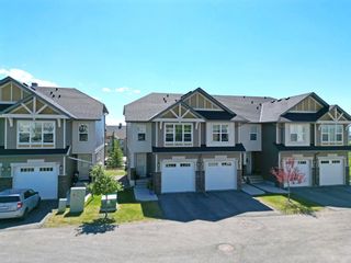 Photo 2: 657 101 Sunset Drive: Cochrane Row/Townhouse for sale : MLS®# A1241880
