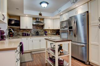Photo 3: 14 448 Strathcona Drive SW in Calgary: Strathcona Park Row/Townhouse for sale : MLS®# A1221433
