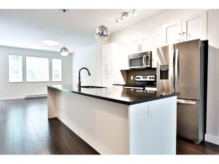 Photo 2: 21 13864 HYLAND Road in Surrey: East Newton Townhouse for sale in "TEO" : MLS®# F1450968