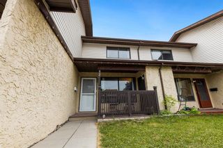 Photo 1: 12 Ranchlands Place NW in Calgary: Ranchlands Row/Townhouse for sale : MLS®# A2054640