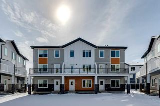 Photo 1: 801 335 Creekside Boulevard SW in Calgary: C-168 Row/Townhouse for sale : MLS®# A2118234