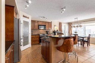 Photo 11: 200 Cougartown Close SW in Calgary: Cougar Ridge Detached for sale : MLS®# A2124049