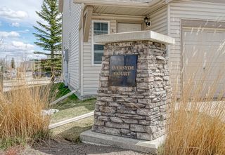 Photo 1: 8 Eversyde Court SW in Calgary: Evergreen Row/Townhouse for sale : MLS®# A1218207