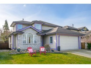 Photo 1: 18246 69 Avenue in Surrey: Cloverdale BC House for sale in "CLOVERWOODS" (Cloverdale)  : MLS®# R2552795