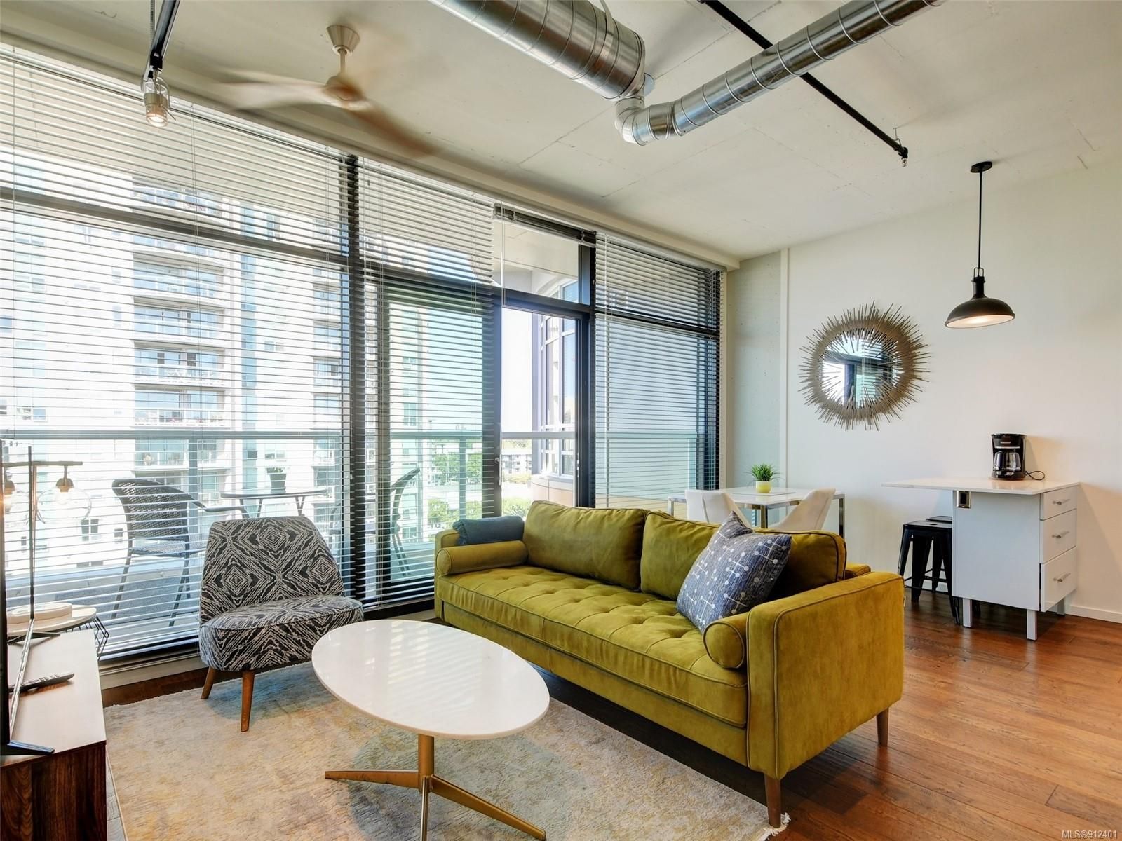 The whole width of the condo boasts Floor to Ceiling windows with access to a 38' wide balcony. New sofa flips to a queen bed..perfect for guests