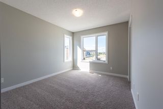 Photo 20: 121 301 REDSTONE Boulevard in Calgary: Redstone Row/Townhouse for sale : MLS®# A1246267