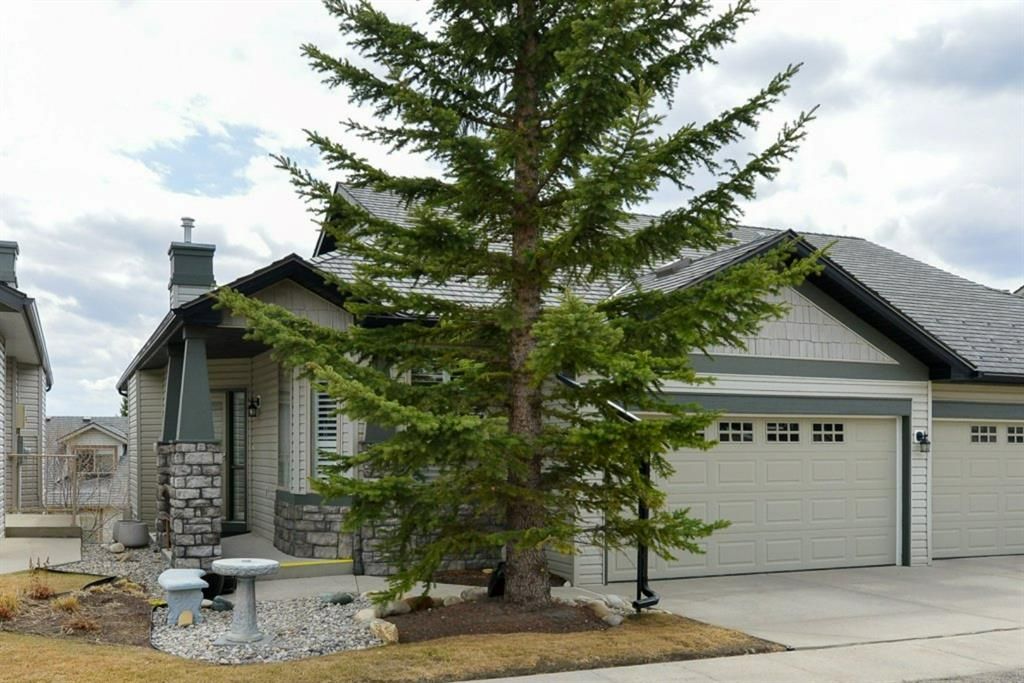 Main Photo: 233 Springbank Terrace SW in Calgary: Springbank Hill Semi Detached for sale : MLS®# A1212349