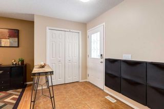 Photo 2: 200 Cougartown Close SW in Calgary: Cougar Ridge Detached for sale : MLS®# A2124049
