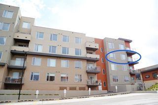 Photo 2: 313 71 Shawnee Common SW in Calgary: Shawnee Slopes Apartment for sale : MLS®# A1221739