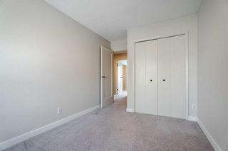 Photo 21: 77 123 Queensland Drive SE in Calgary: Queensland Row/Townhouse for sale : MLS®# A2040135