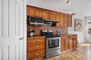 Photo 15: 28 Cougarstone Square SW in Calgary: Cougar Ridge Detached for sale : MLS®# A2036427