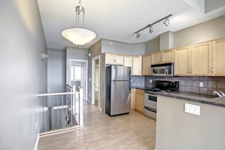 Photo 13: 14 140 Rockyledge View NW in Calgary: Rocky Ridge Row/Townhouse for sale : MLS®# A1199471
