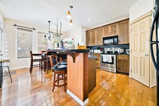Photo 11: 319 St Moritz Drive SW in Calgary: Springbank Hill Detached for sale : MLS®# A1229853