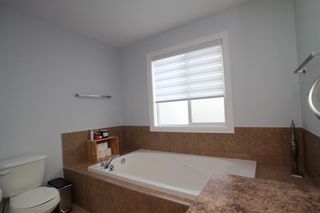 Photo 29: 976 Windsong Drive SW: Airdrie Row/Townhouse for sale : MLS®# A1235668