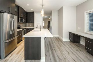 Photo 8: 1104 17 Avenue NW in Calgary: Capitol Hill Detached for sale : MLS®# A2139527