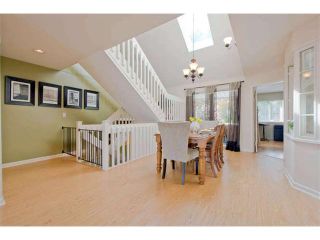 Photo 1: 125 2721 ATLIN Place in Coquitlam: Coquitlam East Townhouse for sale in "THE TERRACES" : MLS®# V1057013