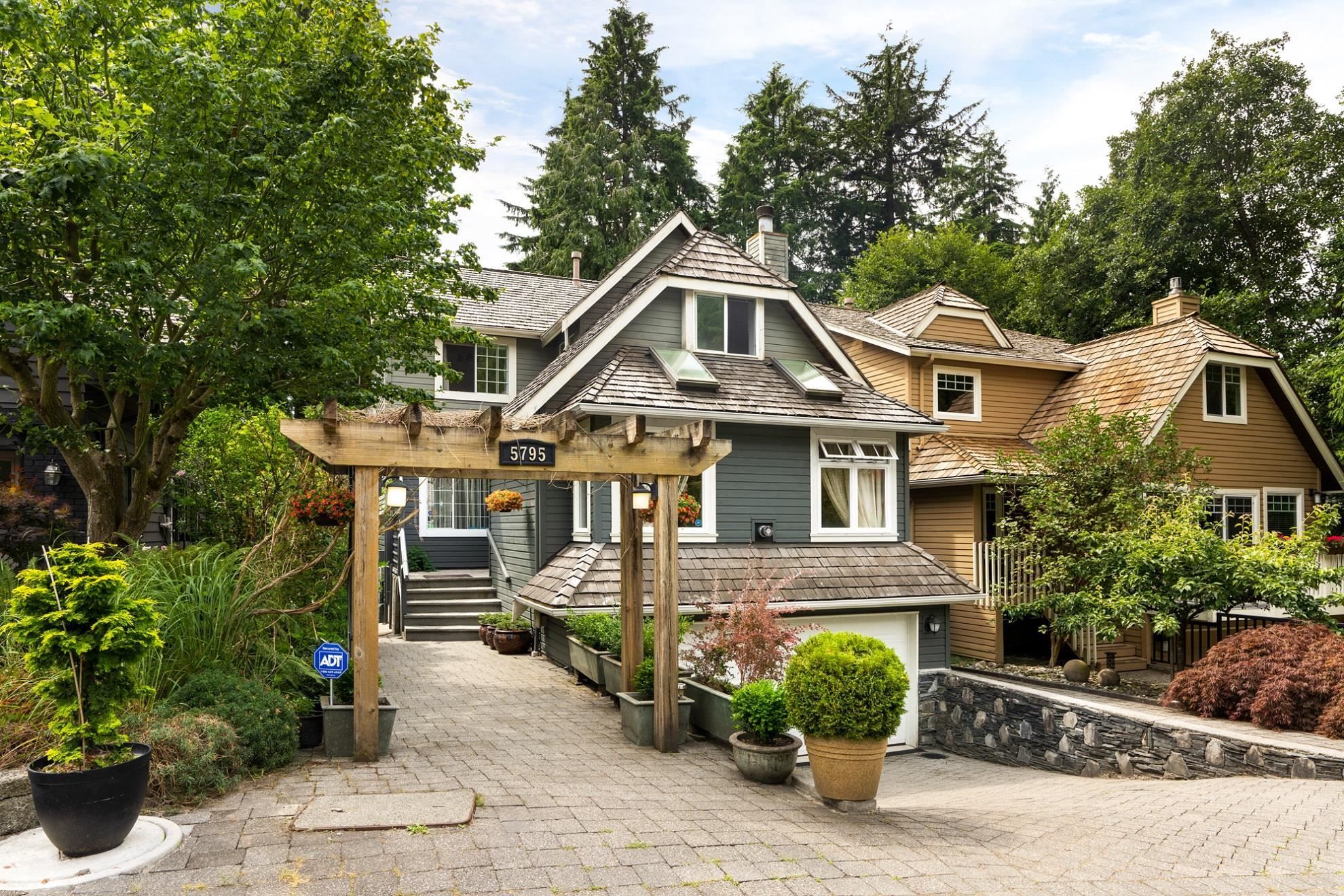 Main Photo: 5795 GROUSEWOODS Crescent in North Vancouver: Grouse Woods House for sale in "Grouse Woods" : MLS®# R2759197