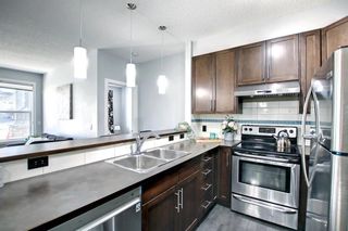 Photo 8: 103 10 Panatella Road NW in Calgary: Panorama Hills Apartment for sale : MLS®# A1216305