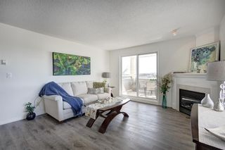 Photo 2: 2109 7451 Springbank Boulevard SW in Calgary: Springbank Hill Apartment for sale : MLS®# A2034205