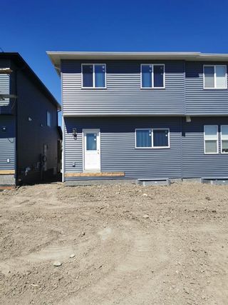 Photo 33: 306 Creekside Boulevard SW in Calgary: C-168 Semi Detached (Half Duplex) for sale : MLS®# A1254336