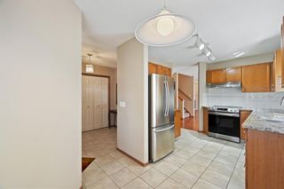 Photo 10: 41 Sun Harbour Road SE in Calgary: Sundance Row/Townhouse for sale : MLS®# A1218017