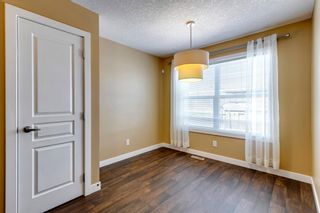 Photo 4: 101 Panatella Road NW in Calgary: Panorama Hills Row/Townhouse for sale : MLS®# A2030502