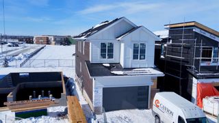 Photo 2: 60 Coulee Crescent SW in Calgary: Cougar Ridge Detached for sale : MLS®# A2029717