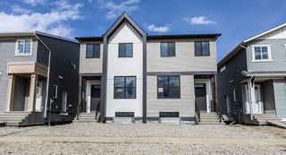 Photo 1: 212 Hotchkiss Drive in Calgary: C-385 Semi Detached (Half Duplex) for sale : MLS®# A2122668
