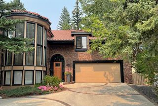 Photo 1: 311 Coach Light Bay SW in Calgary: Coach Hill Detached for sale : MLS®# A2002030