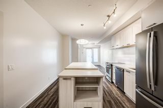 Photo 9: 103 730 5 Street NE in Calgary: Renfrew Apartment for sale : MLS®# A2011808