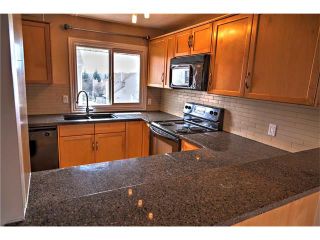 Photo 2: 248 54 GLAMIS Green SW in Calgary: Glamorgan House for sale : MLS®# C4109785