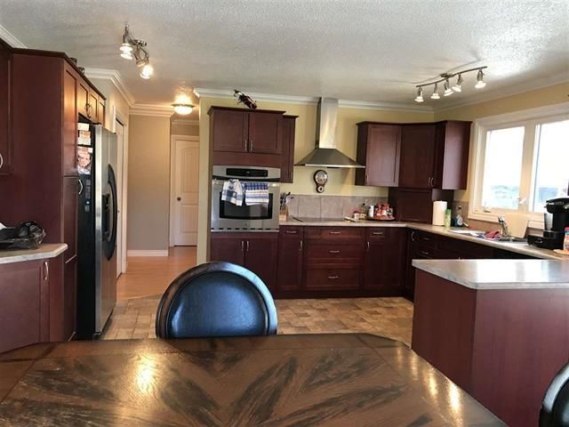 Photo 2: Photos: 5519 51 Street in Fort Nelson: Fort Nelson -Town House for sale in "HILL" (Fort Nelson (Zone 64))  : MLS®# R2634638