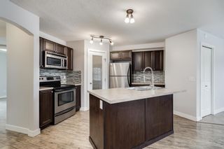 Photo 7: 104 120 Panatella Landing NW in Calgary: Panorama Hills Row/Townhouse for sale : MLS®# A2051554