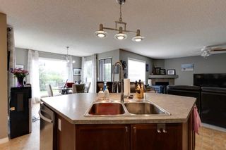 Photo 16: 35 Cougarstone Landing SW in Calgary: Cougar Ridge Detached for sale : MLS®# A2063797