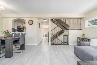 Photo 1: 25 Stradwick Place SW in Calgary: Strathcona Park Semi Detached (Half Duplex) for sale : MLS®# A2125910