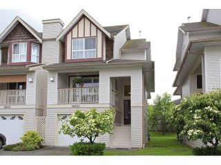 Photo 1: 18650 65TH Avenue in SURREY: Cloverdale BC Townhouse for sale in "RIDGEWAY" (Cloverdale)  : MLS®# F1215322