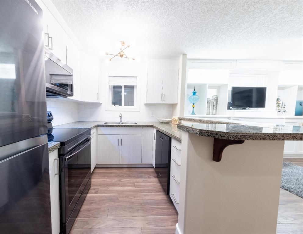 Photo 18: Photos: 103 1727 13 Street SW in Calgary: Lower Mount Royal Apartment for sale : MLS®# A1202865