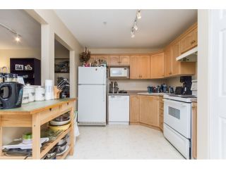 Photo 4: 201A 301 MAUDE Road in Port Moody: North Shore Pt Moody Condo for sale in "HERITAGE GRAND" : MLS®# R2077072