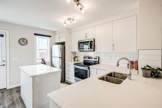 Photo 4: 128 Cranbrook Square SE in Calgary: Cranston Row/Townhouse for sale : MLS®# A1232257