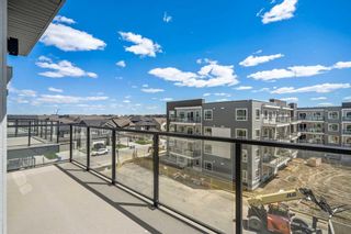 Photo 5: 1411 33 Carringham Gate NW in Calgary: Carrington Apartment for sale : MLS®# A2139090