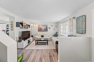 Photo 3: 221 Queenston Heights SE in Calgary: Queensland Row/Townhouse for sale : MLS®# A2125332