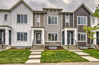 Photo 1: 7443 202 Avenue SE in Calgary: C-390 Row/Townhouse for sale : MLS®# A2077842
