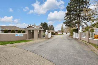 Photo 1: 103 15501 89A Avenue in Surrey: Fleetwood Tynehead Townhouse for sale in "AVONDALE" : MLS®# R2684583